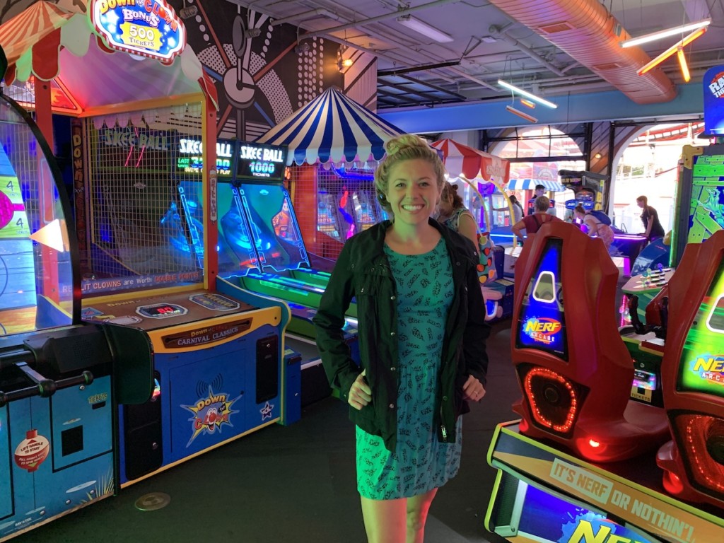 Girl standing in arcade room at Belmont Park in Mission Bay