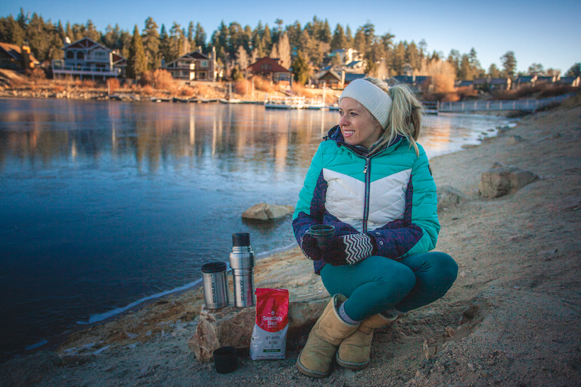 Girl with her coffee while out camping
