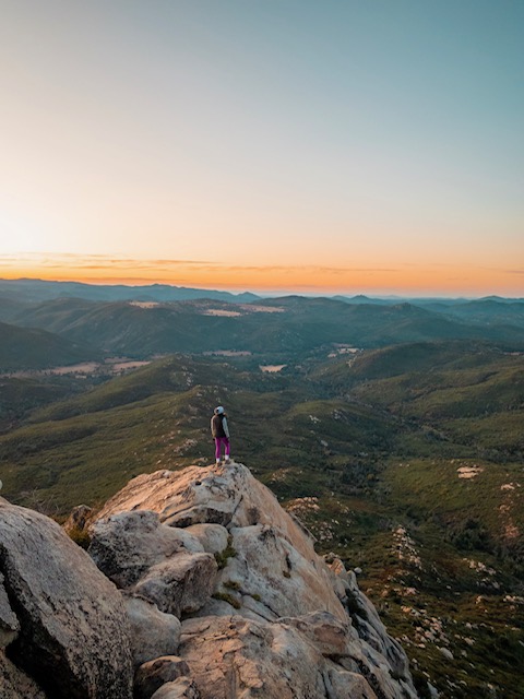 Girl on top of mountain in Julian for a sunrise in San Diego