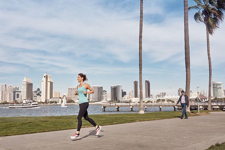 Girl running in San Diego along the Harbor