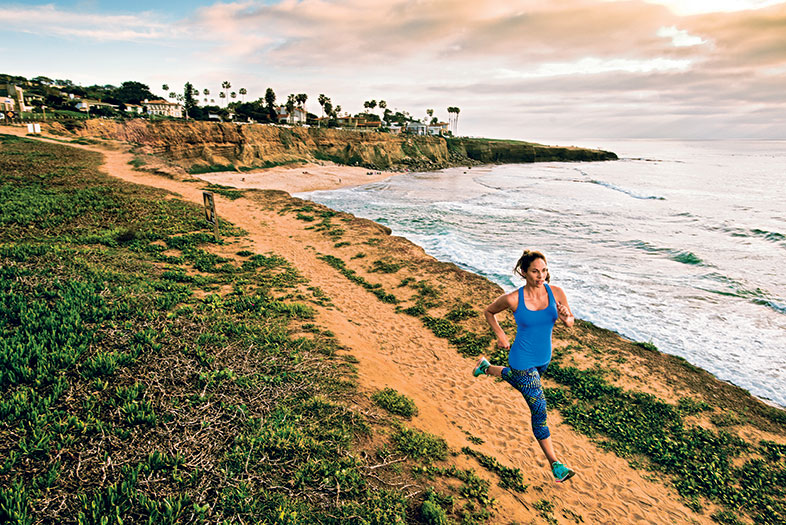 Girl going for a run in San Diego along Sunset Cliffd