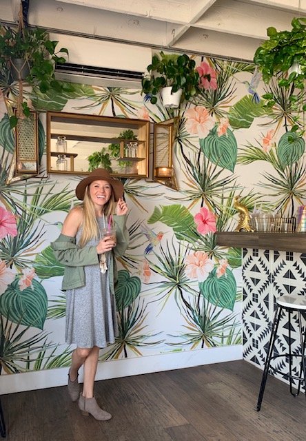 Girl in one of the most instagrammable coffee shops in San Diego called the Grounds Bean Bar