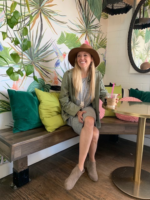 Girl in one of the most instagrammable coffee shops in San Diego called the Grounds Bean Bar