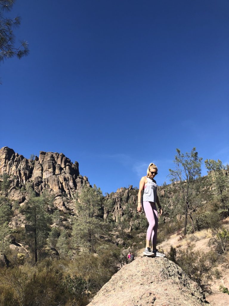 Chelsey on a rock in Pinnacles National Park one of the most underrated parks