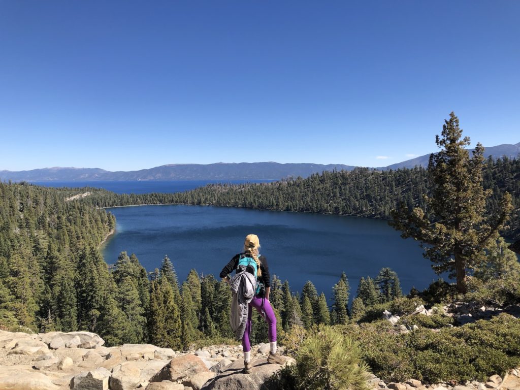 Chelsey standing on a rock overlooking Lake Tahoe