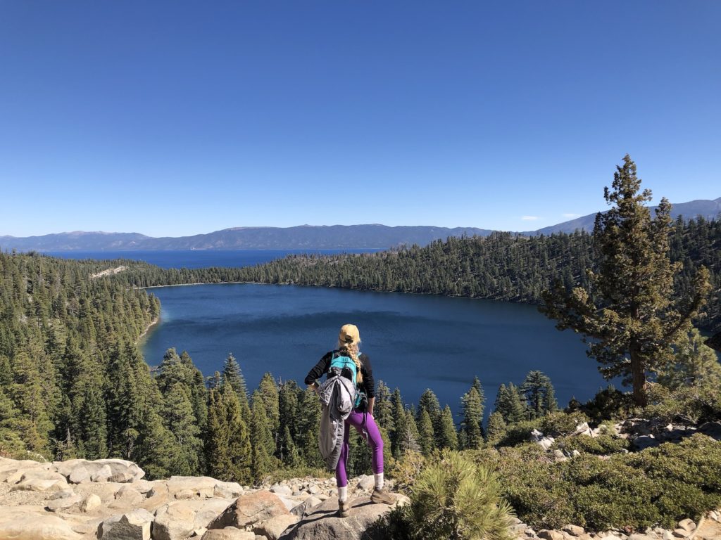 Chelsey standing on a rock overlooking Lake Tahoe 