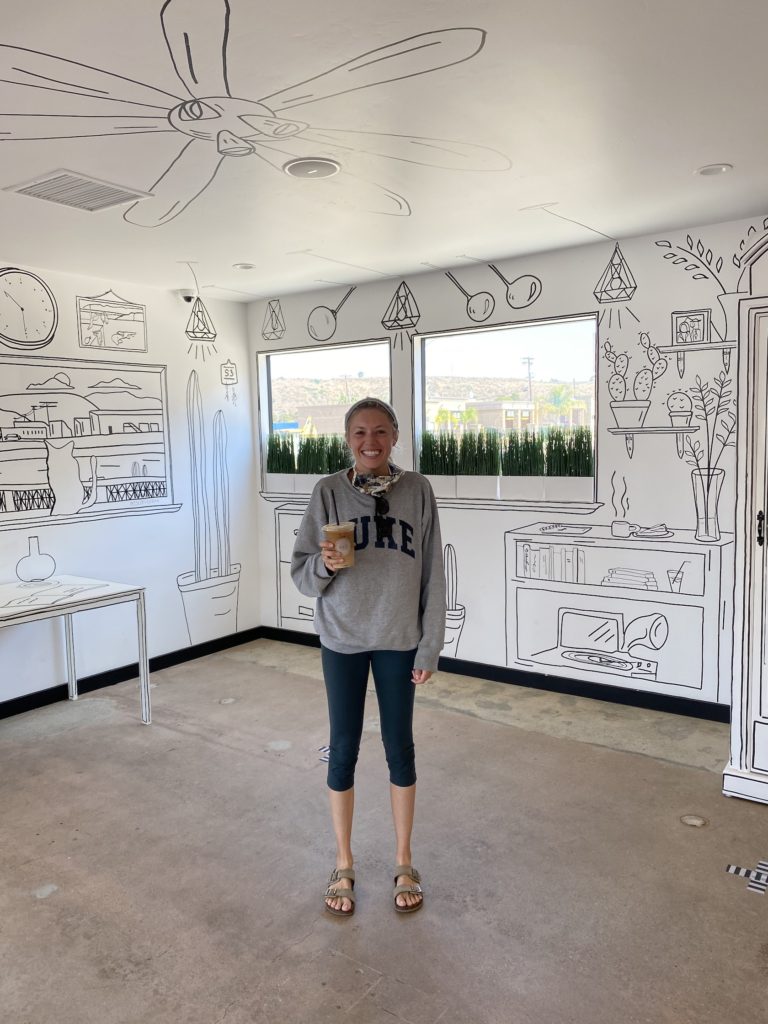 Chelsey standing in the middle of S3 Coffee Bar