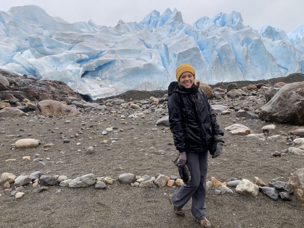 Girl standing up close to the Perito Moreno Glacier