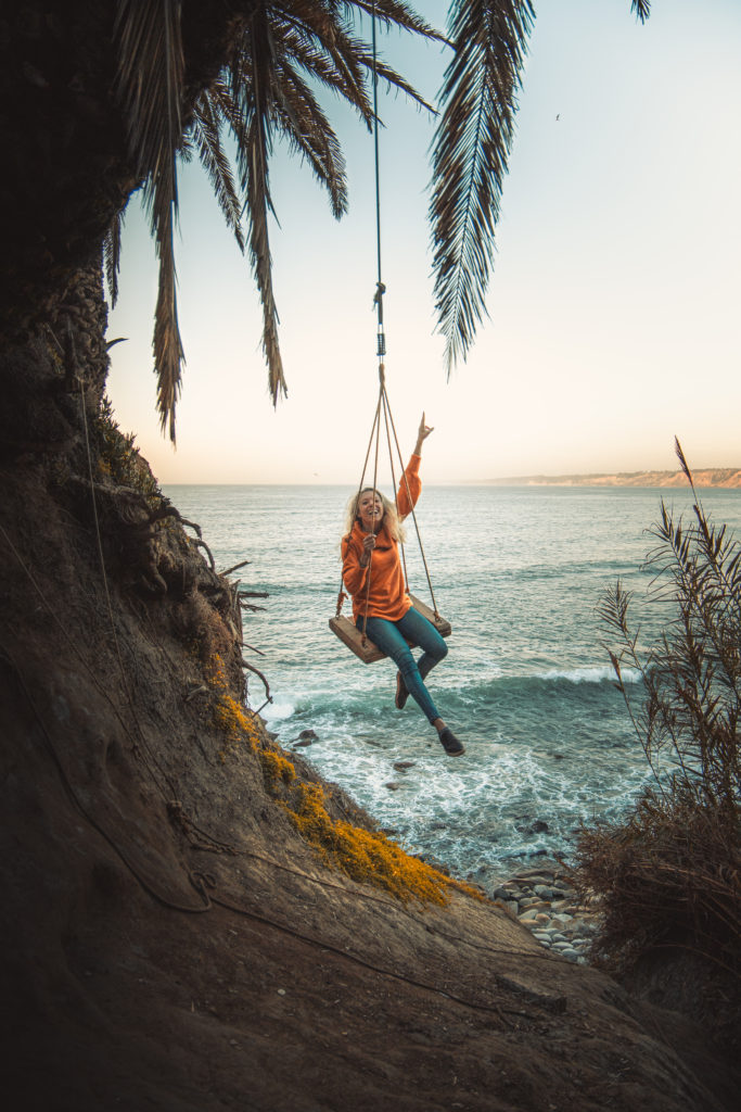 Girl swinging on the La Jolla Swing