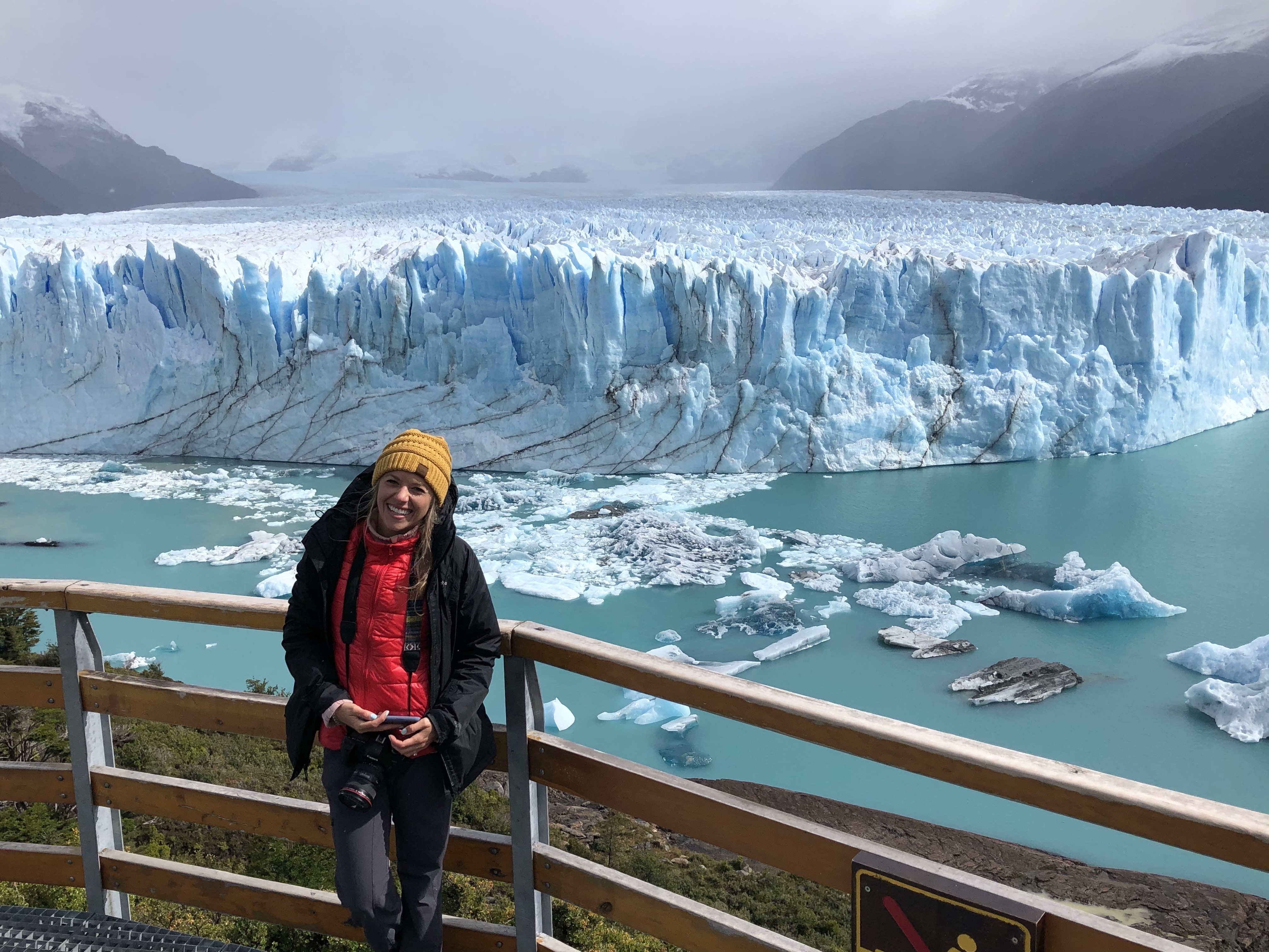 Girl standing on boardwalk with views of the Perito Moreno Glacier in the background