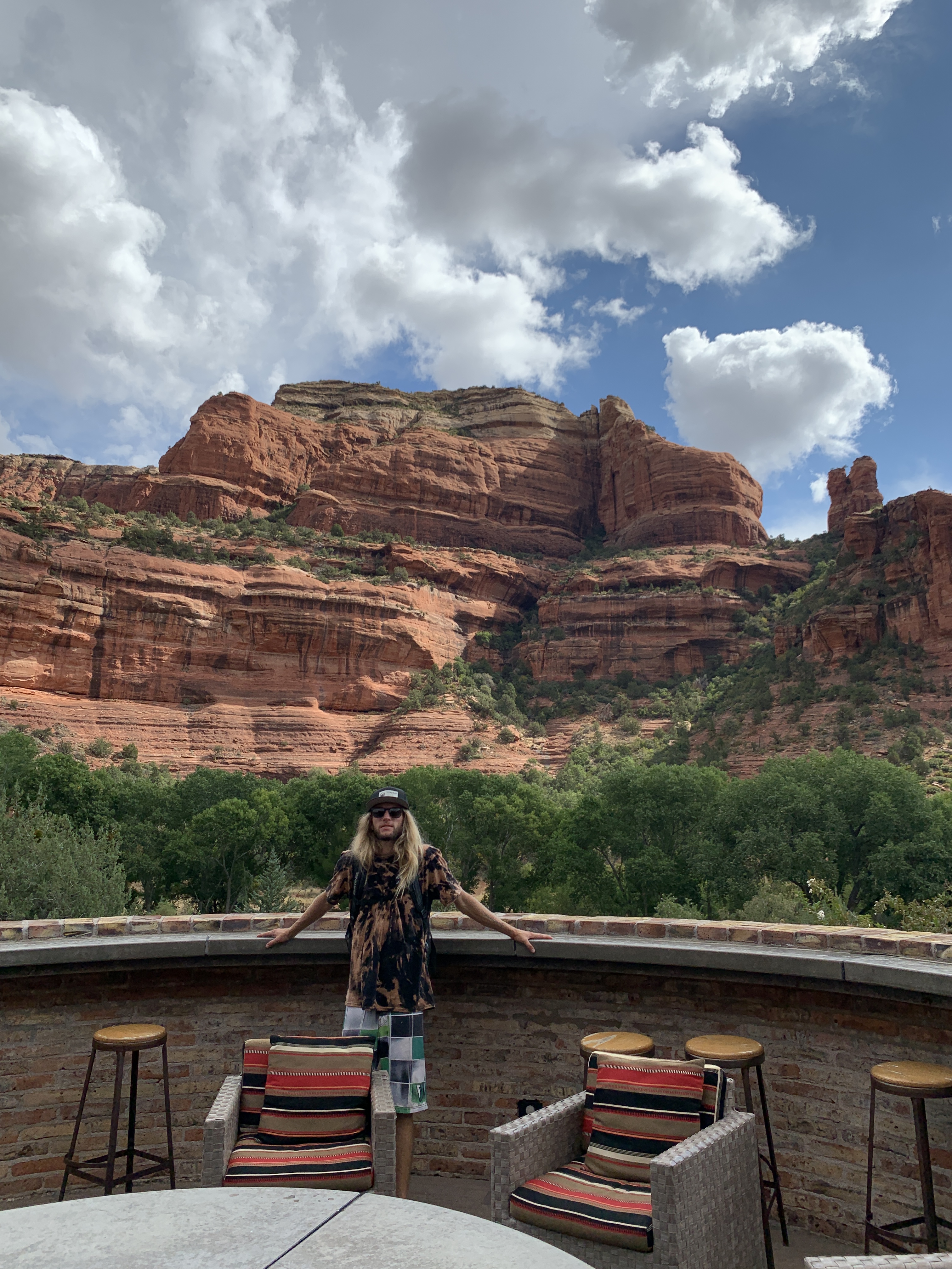 guy standing in front of the views from the Enchantment resort