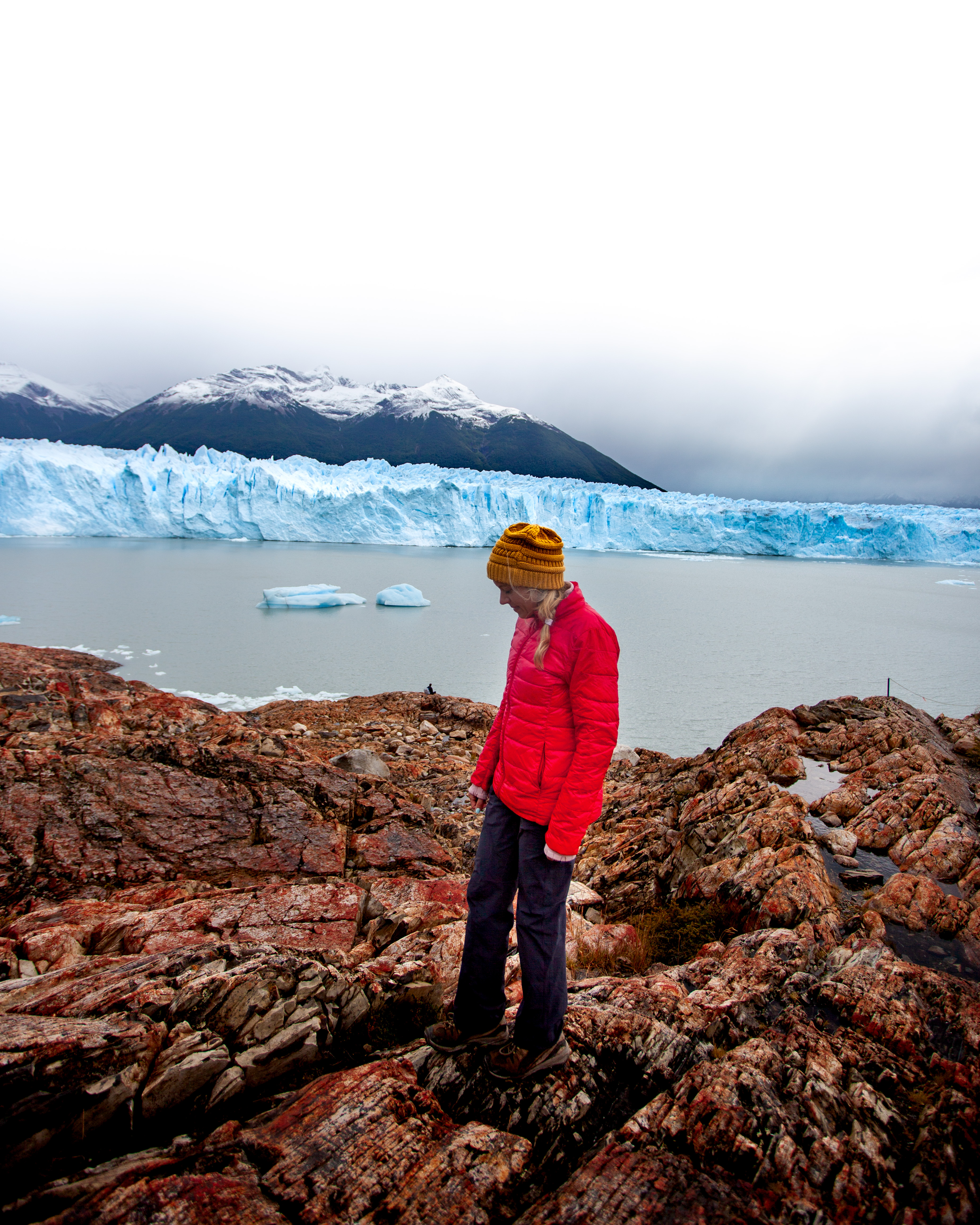 Girl walking in front of the Perito Moreno Glacier