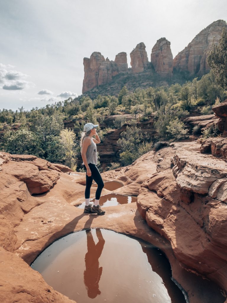 Girl standing in front of the seven sacred pools 