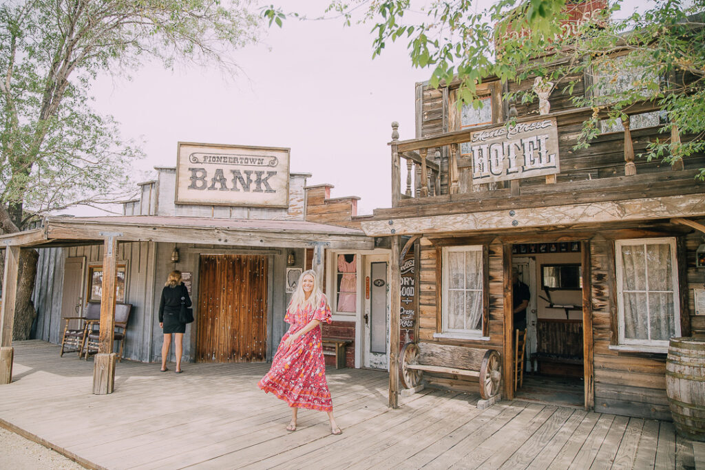 Chelsey standing in Pioneertown which is one of the things you must do in Joshua Tree