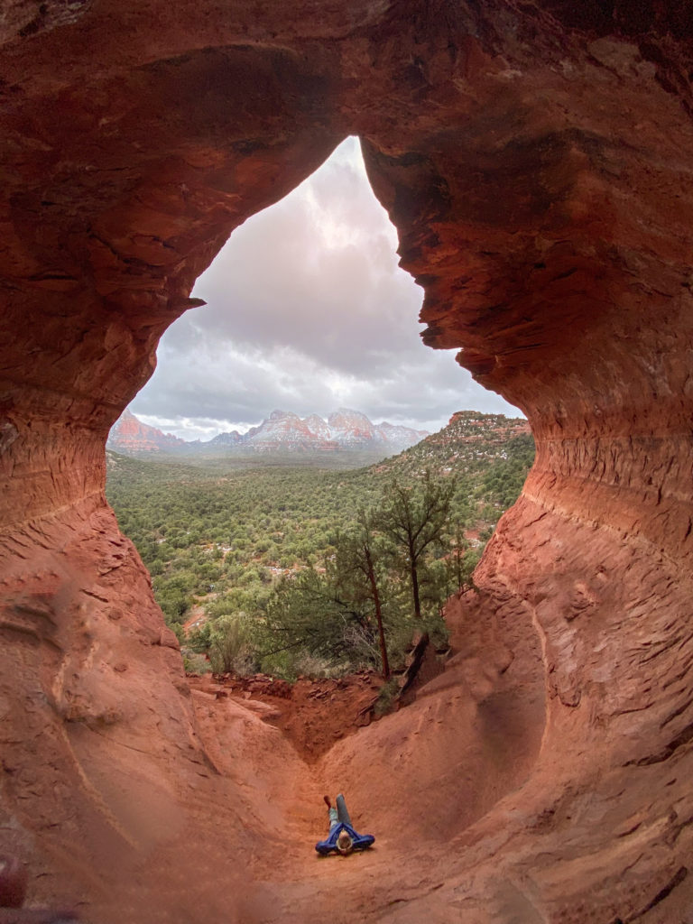 Girl in the birthing cave which is one of the most unique Sedona Hiking trails