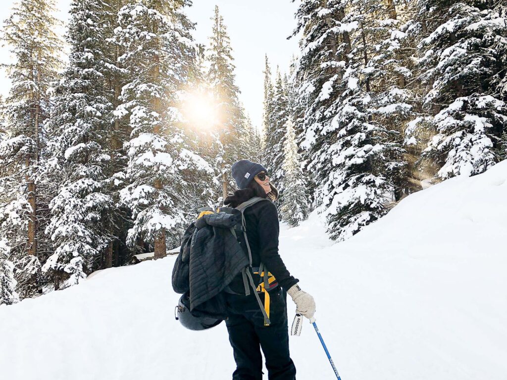 Girl backpacking in the snow