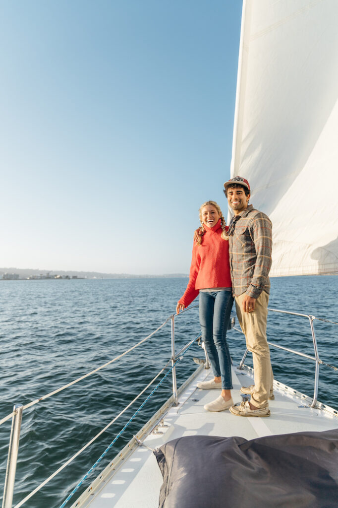 Couple aboard a sailboat in the San Diego bay