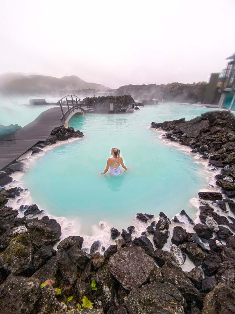 Girl in the Blue Lagoon which is a must add stop to your Iceland itinerary