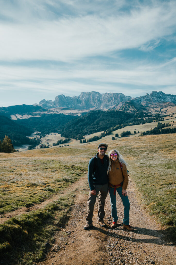 Couple standing on the trail while hiking to Saltria in the Dolomites