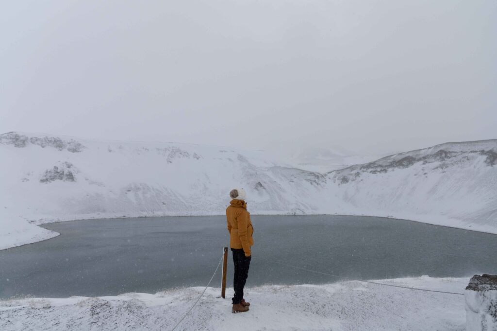 Girl standing and looking at Viti Crater