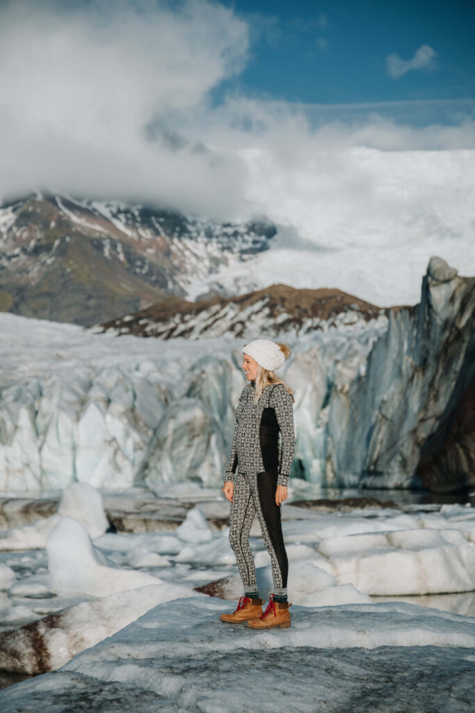 Girl standing on an Iceberg on the Svinafellsjokull Glacier