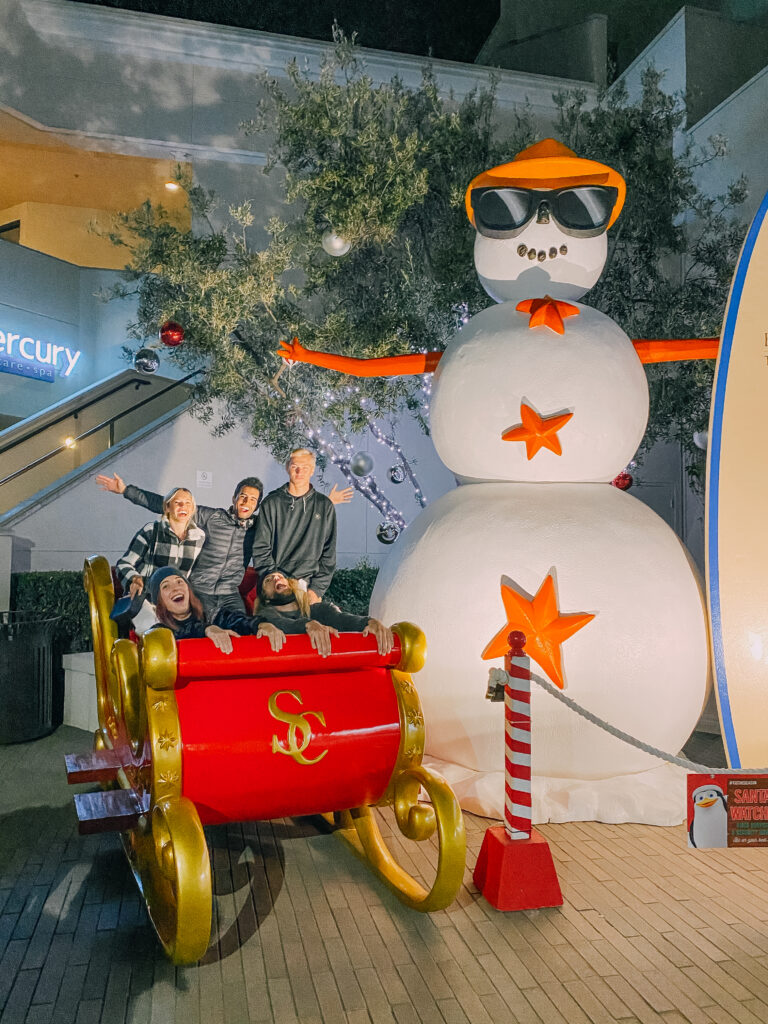 Family sitting on a sleigh at the Del Mar Heights Town Center