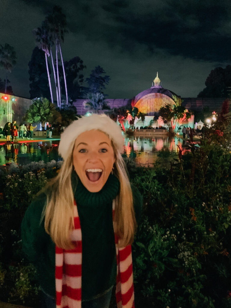 San Diego influencer at December nights in Balboa Park which is one of the best San Diego Christmas events