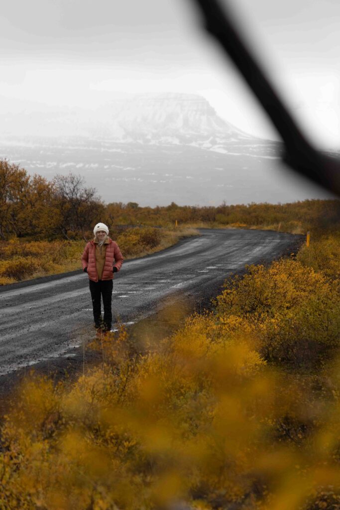 Girl standing in the Fall colors in Iceland