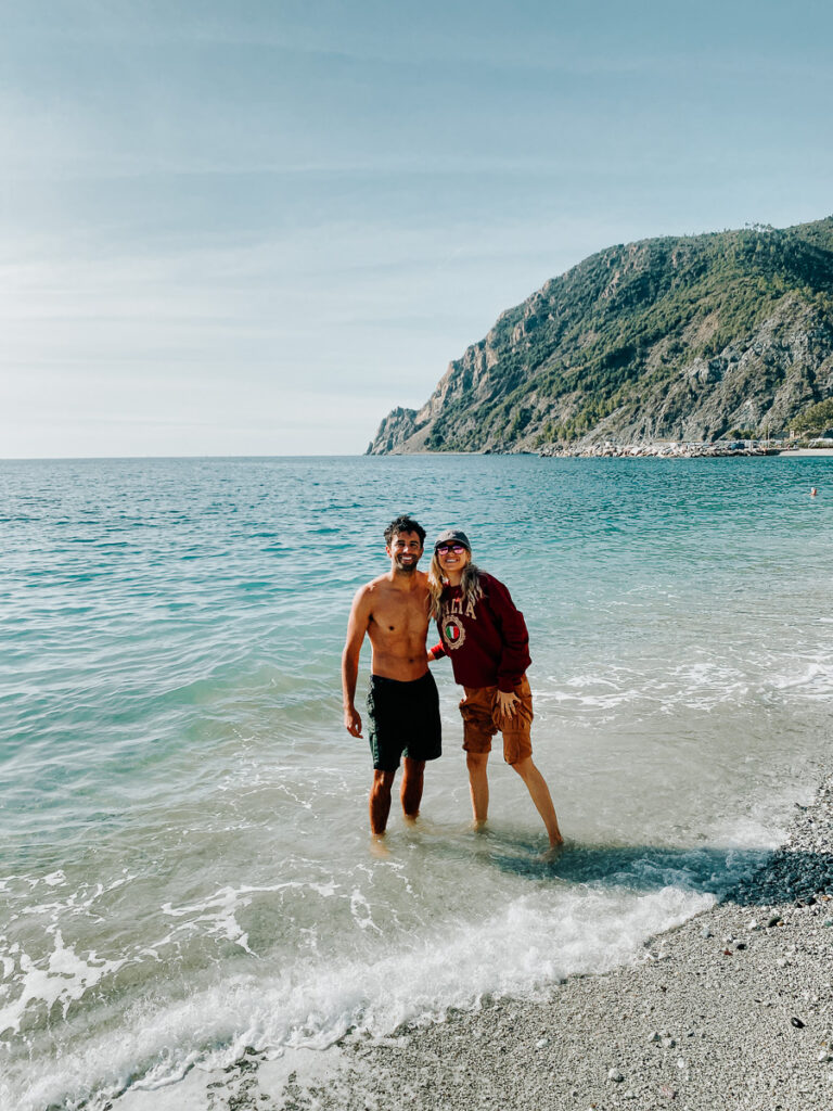 Couple in the. beach water in the city of Monterosso