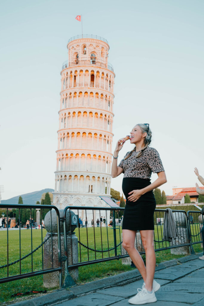 Chelsey Explores eating ice cream in front of the leaning tower of Pisa