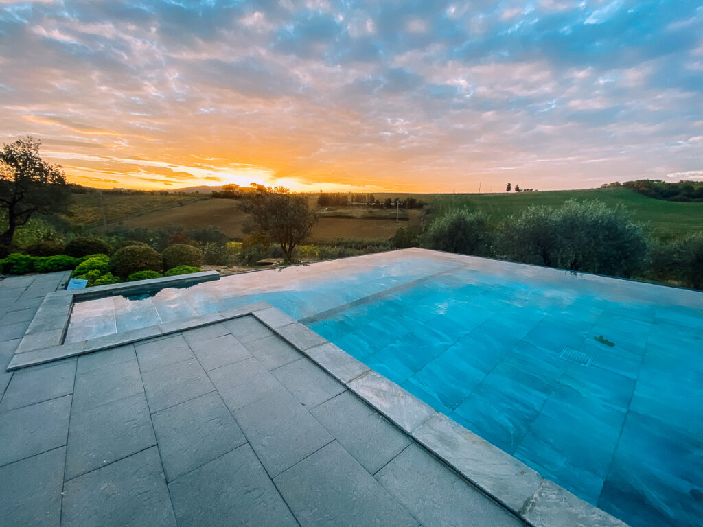 Sunrise views of a pool at a Tuscany airbnb