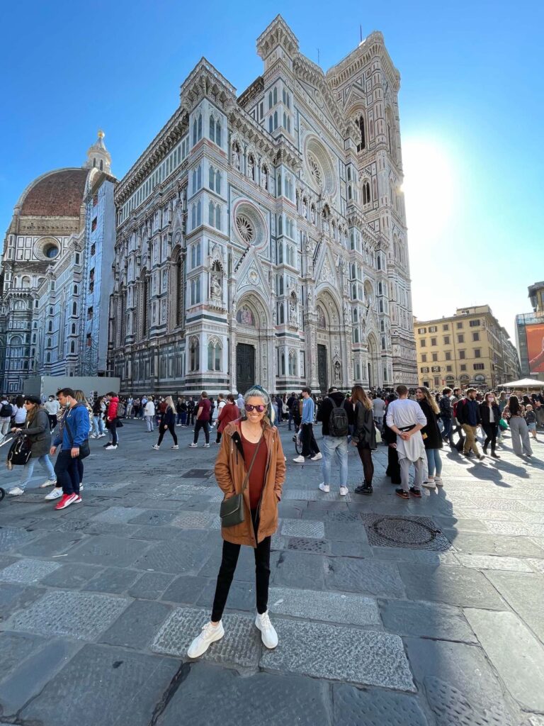 Chelsey Explores standing in front of the Duomo in Florence