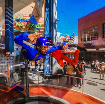 Man indoor skydiving at ifly San Diego which is a great rainy day activity