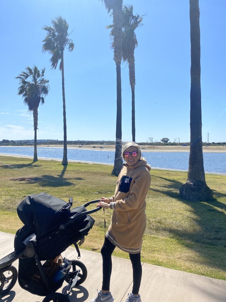 Girl walking her stroller at Mission Bay Park