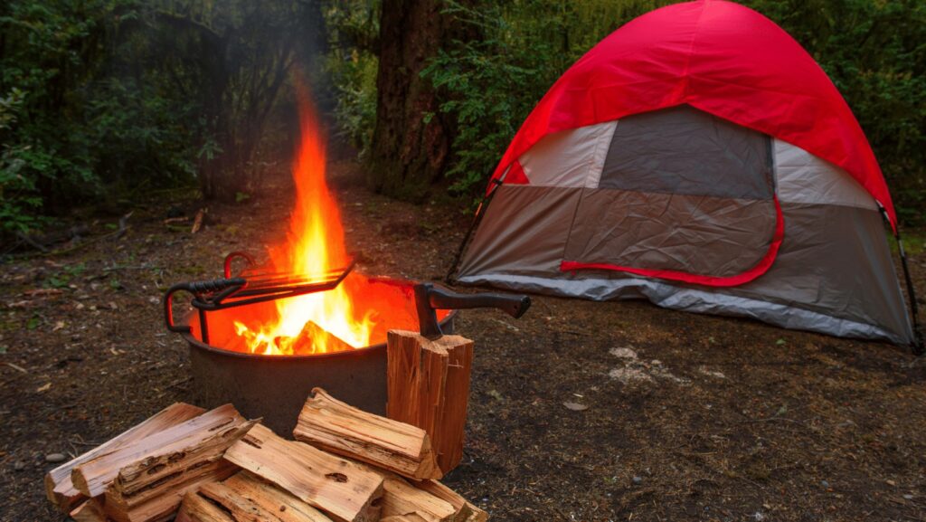 Campfire and tent makes for a great setting for campfire breakfast burritos