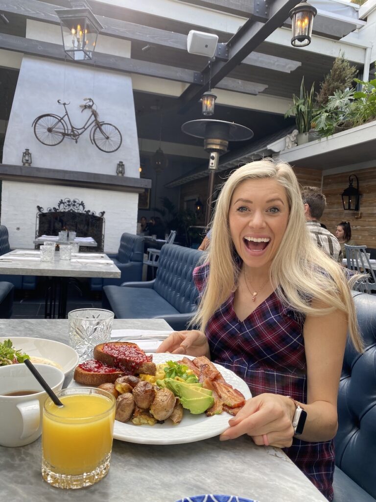 Chelsey eating breakfast at Herb and Wood in Little Italy