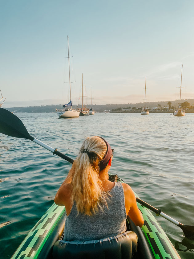 Girl kayaking on Shelter Island in Point Loma