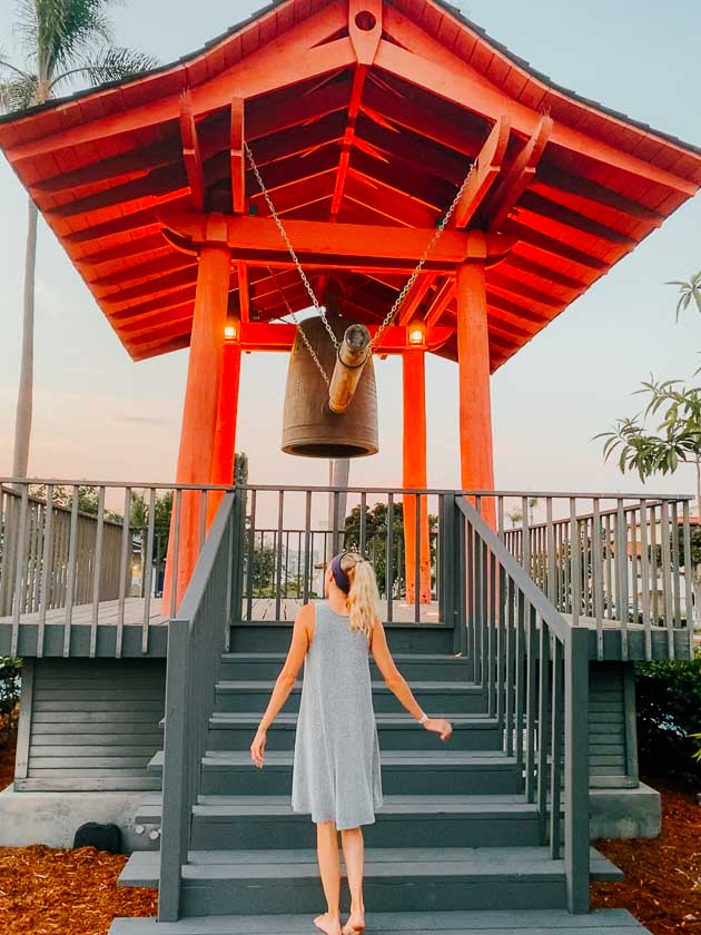 Girl standing in front of Bell tower on shelter Island