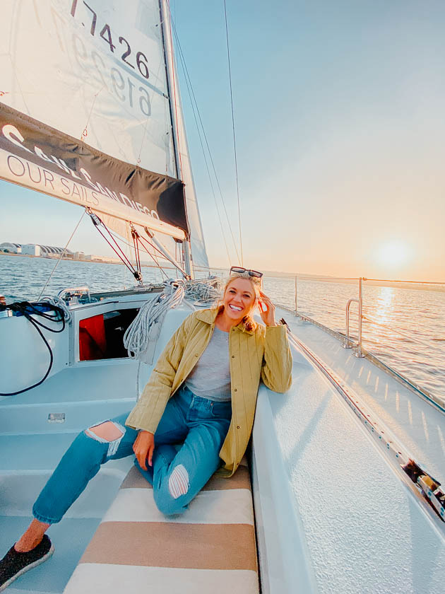 Girl sitting on a sailboat 