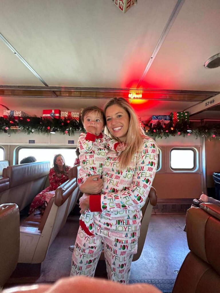 Mom and son standing on the Polar Express train 