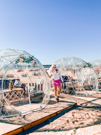 Girl standing in front of Igloos on Coronado Island