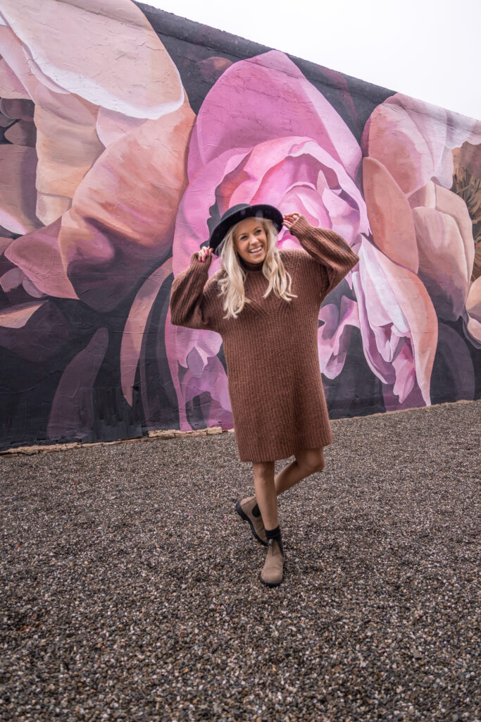 Girl standing in front of mural in downtown Livermore