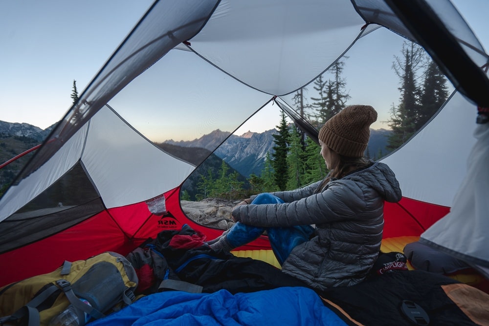 female camping in tent