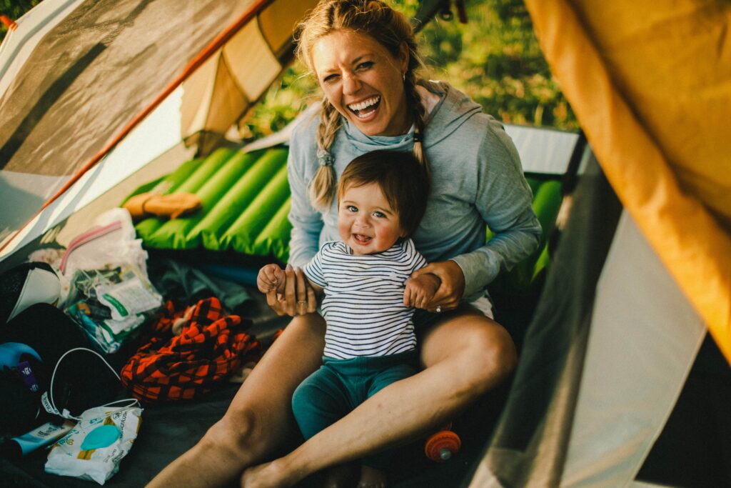 mom and son camping in tent
