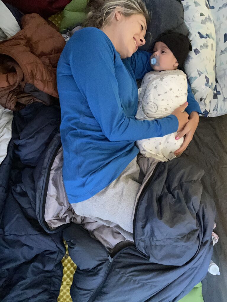 baby sleeping in tent with mom