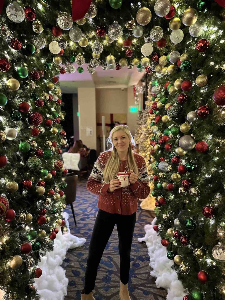 Girl in archway at Top of the Hyatt Christmas Bar in San Diego